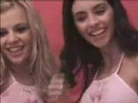Sexy chicks in pink touch each other