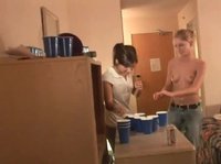 Two barely legal chicks play topless beer pong